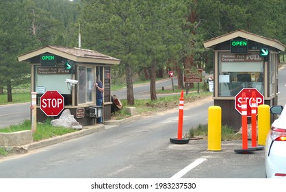 Estes Park, CO USA - May 28, 2021: Cars Line Up To Enter Rocky Mountain National Park. Pay Station At The Fall River Entrance                              