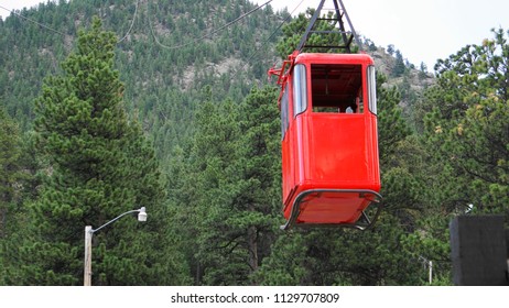 ESTES PARK, COLORADO, U.S.A, JULY 8, 2018 - Empty Red Funicular Coming Down The Mountain To Load Tourists On The Popular Attraction Of Estes Park Aerial Tramway In Estes Park, Colorado