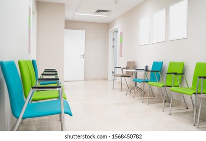 Esthetic and clean modern private clinic or vet waiting room with empty posters