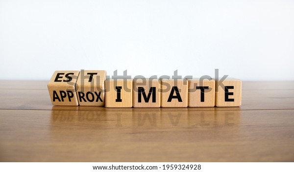 Estimate or approximate symbol. Turned wooden\
cubes and changed the word \'approximate\' to \'estimate\'. Beautiful\
wooden and white background, copy space. Business, estimate or\
approximate concept.