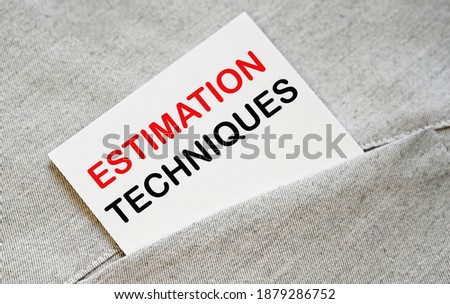 ESTIMATION TECHNIQUES text on the white sticker in the shirt pocket.