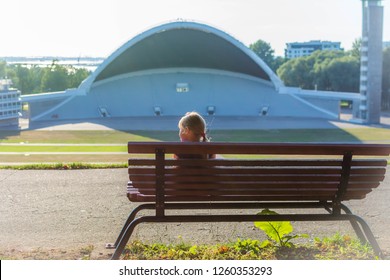 Estonia - 25/07/2018 Little Girl Is Sitting Infront Estonian Song Festival Grounds