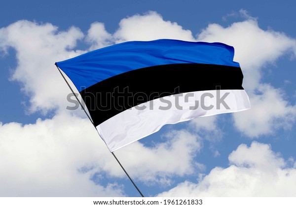 Estonia flag\
isolated on sky background with clipping path. close up waving flag\
of Estonia. flag symbols of\
Estonia.