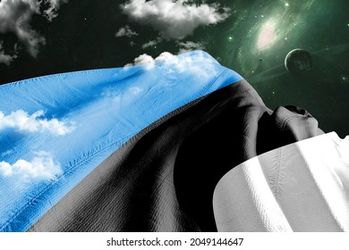 Estonia national flag cloth fabric waving on beautiful sky.