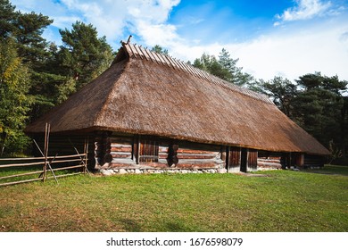 Estonian Traditional Vernacular Architecture With Straw Thatched Roof And Log Walls