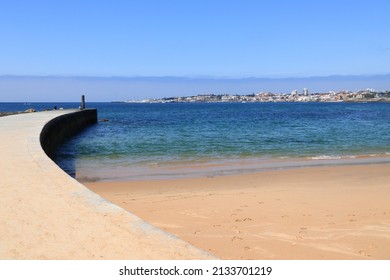 Estoril, Portugal - Tamariz Beach sand and pier.