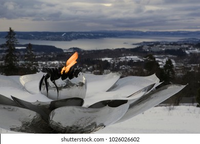 Eternal Peace Flame above the city of Oslo and Oslo fjord at Holmenkollen, Norway. January 5, 2018