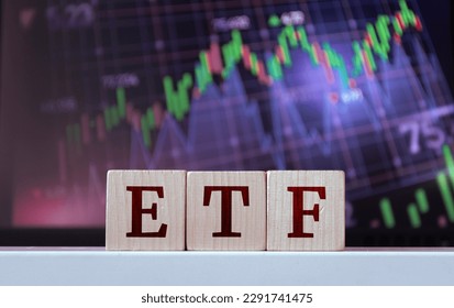 ETF - acronym from wooden blocks with letters, Exchange-traded fund. Financial market concept