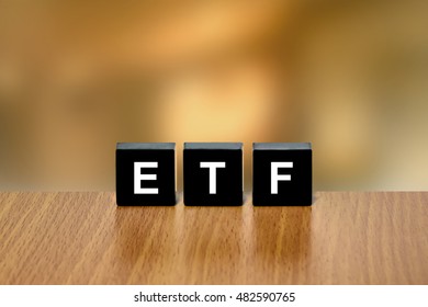 ETF Or Exchange Traded Fund On Black Block With Blurred Background