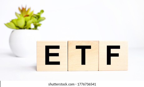 ETF, Exchange Traded Fund, Realtime Mutual Index Fund That Can Trade In Equity Stock Market, Cube Wooden Block With Alphabet Building The Word ETF.