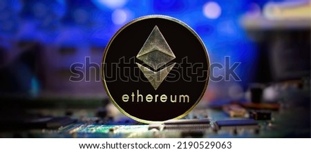 ETH coin with blurred candlestick chart in the background. Ethereum is a decentralized, open-source blockchain with smart contract.