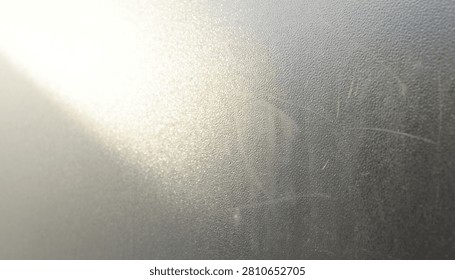 An ethereal abstract background featuring soft golden light flares and a hazy atmospheric glow creating a dreamy and artistic visual effect