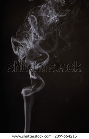 Ethereal Incense Smoke Swirls Against Dark Background