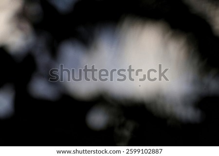 Ethereal light breaking through the void, revealing dreamy soft textures of an unknown cosmos with nebulous forms and smoky elements