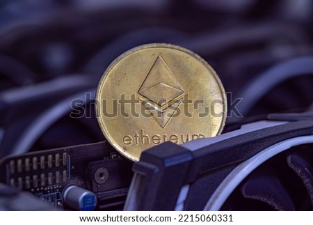 Ethereum coin (ETH) is placed on a cryptocurrency miner made of VGA cards. Proof-of-Stake (PoS) Concept.