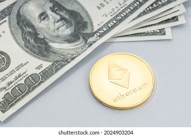 Ethereum Coin And A Pile Of US Dollar Banknotes. Blockchain Money Versus Fiat Money Concept