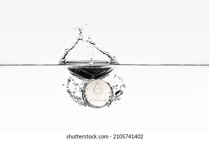 Ethereum coin water splash. ETH water dive isolated on white gradient