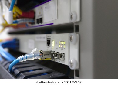 Ethernet Cable Pluged On Switch With GBIC Module In An Old Data Center With LED Status On On It Panel