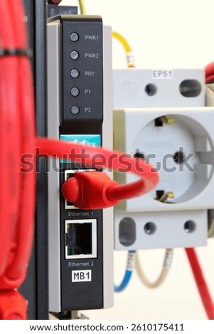 Ethernet data switch with connected patchcords with Rj45 connectors. 