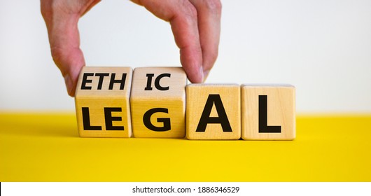 Ethical or legal symbol. Businessman hand turns wooden cubes and changes the word 'legal' to 'ethical' on a beautiful yellow table, white background. Business and ethical or legal concept. Copy space. - Shutterstock ID 1886346529