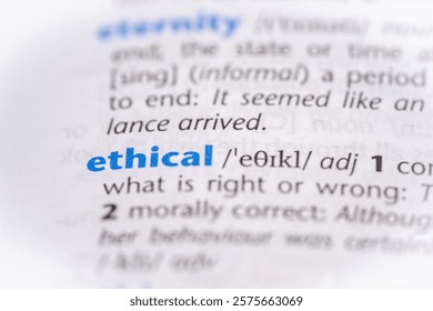Ethical word in a dictionary. Selective focus, close up.