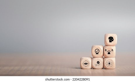 Ethics inside human mind, Business ethics concept. Ethics inside a head symbols in wooden cubes stacked on gray background with copy space. - Shutterstock ID 2204228091