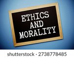 Ethics And Morality text written on chalkboard flat lay on blue background