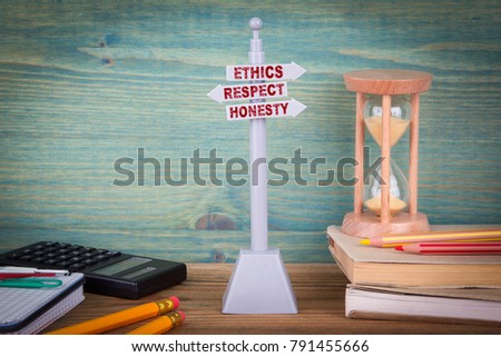 ethics respect honesty, code of conduct. Signpost on wooden table