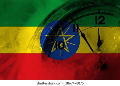 Ethiopia, Ethiopian Flag With Clock Close To Midnight In The Background. Happy New Year Concept