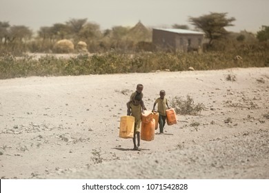 Ethiopia, Jigjiga 2016
Children Who Are Thirsty In Their Homes Due To Drought In Africa.
They Carry Water To Their Homes In Canisters.