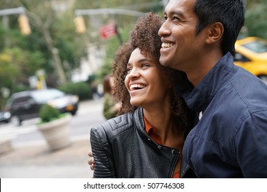 Ethnic Couple Walking In New York City Street 