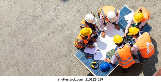 Ethnic Diversity Worker People, Success Teamwork. Group Of Professional Engineering People Wearing Hardhat Safety Helmet Meeting With Solar Photovoltaic Panels Discussion In New Project