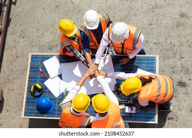 Ethnic Diversity Worker People, Success Teamwork. Group Of Professional Engineering People Wearing Hardhat Safety Helmet Meeting With Solar Photovoltaic Panels Discussion In New Project