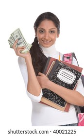 Ethnic Indian College Student With Compositions Notebook, Copybooks And Backpack Holds Pile 100 (one Hundred) Dollar Bills Happy Getting Money Help To Subsidies Costly University Cost