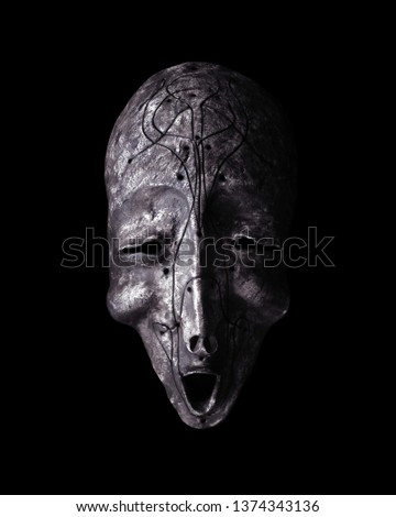 Ethnic mask. Mask for holiday ritual and carnival isolated on black background.   