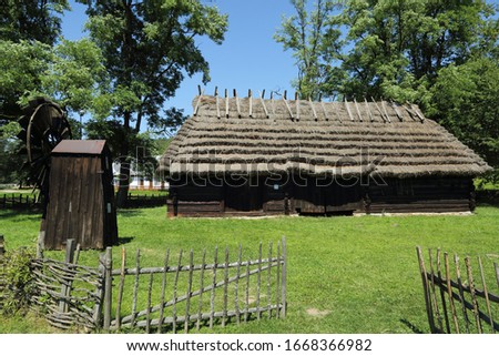 Ethnographic wooden houses in Poland. Authentic and historic old cottages at the country.Traditional buildings in the Polish village.