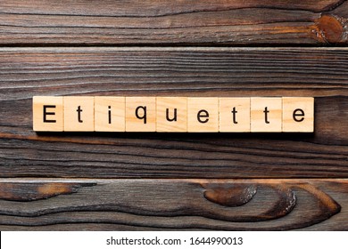 ETIQUETTE word written on wood block. ETIQUETTE text on wooden table for your desing, concept.