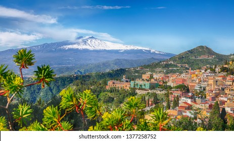 Etna volcano and Taormina town aerial panoramic view. Roofs of a lot of buldings. Smoking snow-capped Mount Etna volcano. Taormina, Sicily, Italy. - Shutterstock ID 1377258752