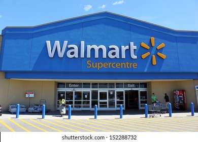 ETOBICOKE, CANADA - JULY 24: Walmart Supercentre entrance on July 24, 2013 in Etobicoke, Ontario, Canada. Walmart is the world's third largest public corporation that runs chains of department stores.