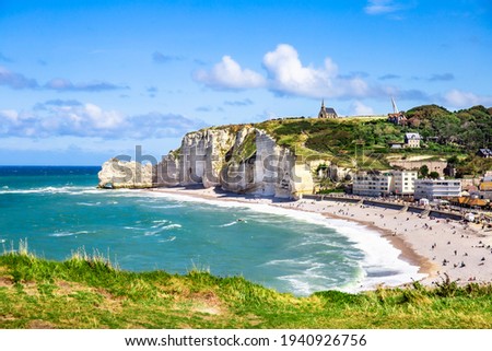 Etretat Aval cliff, rocks and natural arch landmark and blue ocean. Normandy, France, Europe. Beatiful summer panorama.