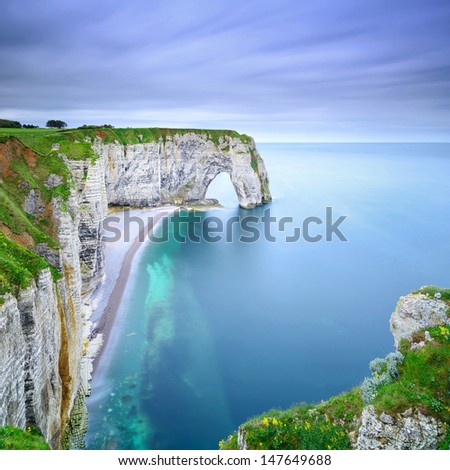 Etretat, la Manneporte natural rock arch wonder, cliff and beach. Long exposure photography. Normandy, France.