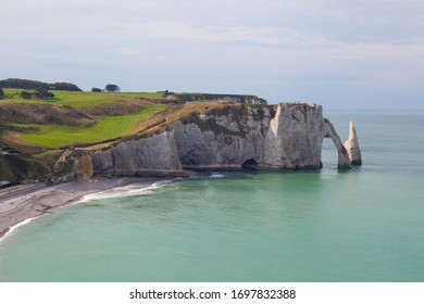 Etretat, Seine-Maritime, Normandie / France - OCTOBER 14, 2018: Etretat is best known for its chalk cliffs, which include natural arches, monolithic formations and its rocky beach.
