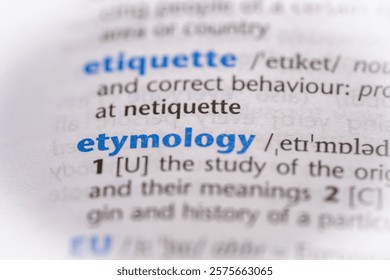 Etymology word in a dictionary. Selective focus, close up.