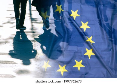 EU Or European Union Flag And Shadows Of People, Concept Political Picture	