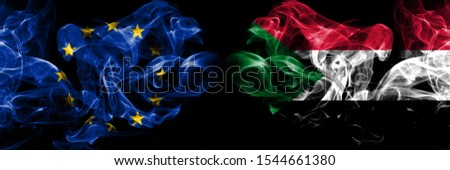 Eu, European union vs Sudan, Sudanese smoke flags placed side by side. Thick colored silky smokes abstract flags 