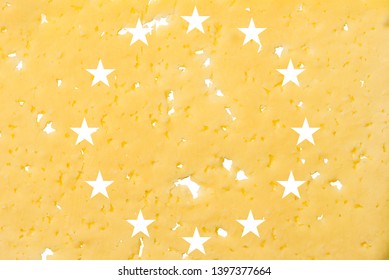 EU Flag Cut Out Of Cheese, As A Symbol Of The Import Or Export Of Cheese On A White Isolated Background. Horizontal Frame