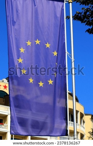 EU flag outdoors. European Union blue flag with gold stars, Commonwealth of Independent States