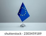 EU flag in a stand on table
