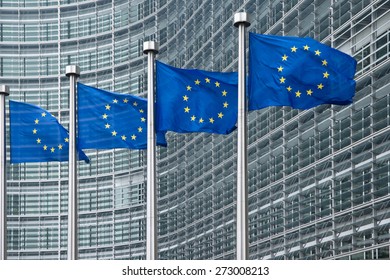 EU flags in front of European Commission in Brussels - Shutterstock ID 273008213