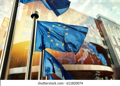EU flags waving in front of European Parliament building. Brussels, Belgium - Shutterstock ID 611820074
